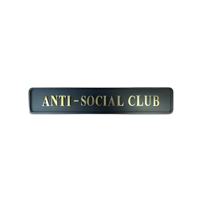 Black and Gold Wooden Sign with text reading "anti social club"