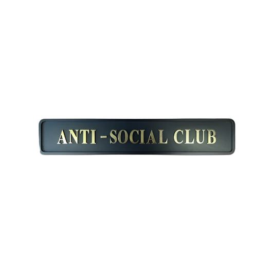 Black and Gold Wooden Sign with text reading "anti social club"