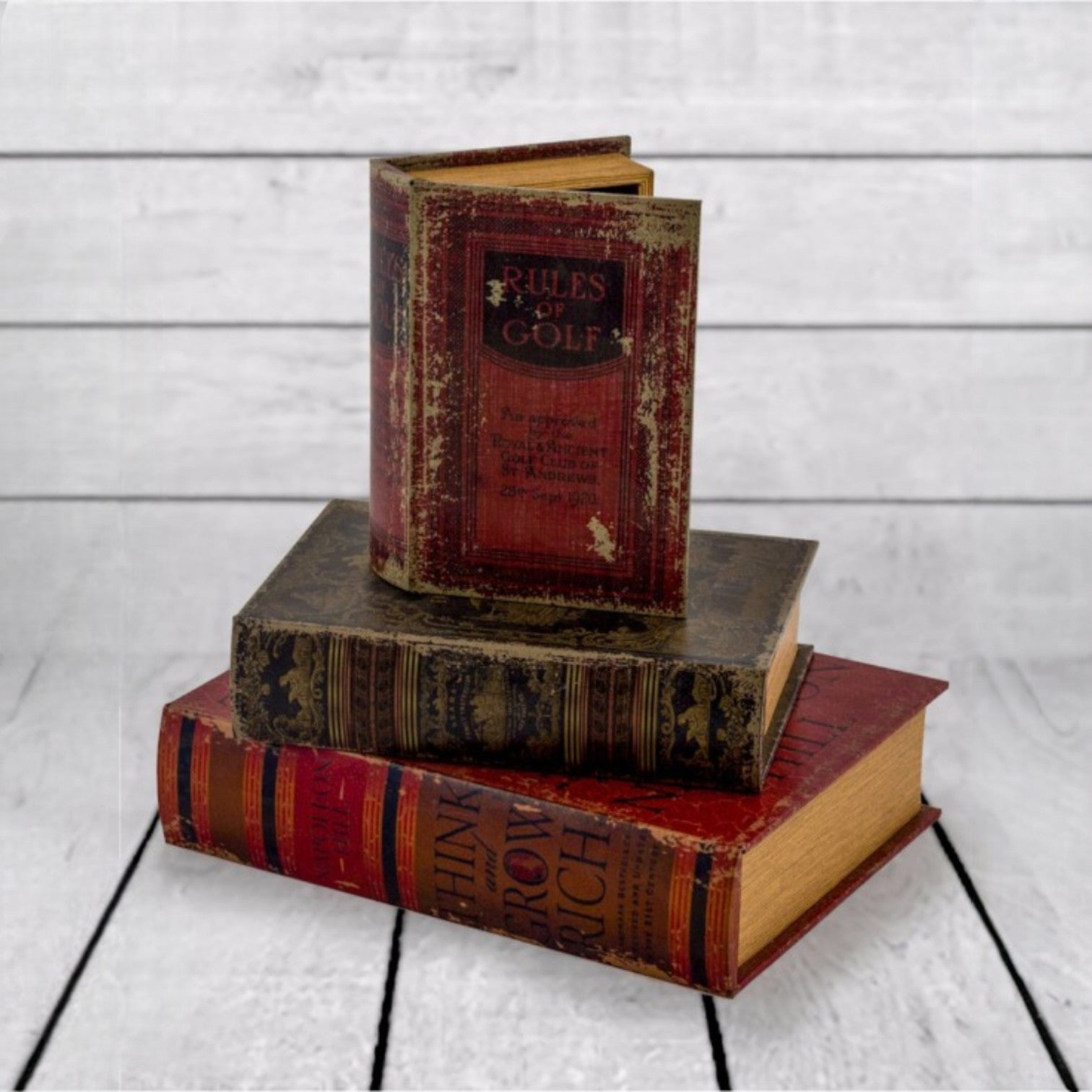 Stack of vintage books on a wooden surface