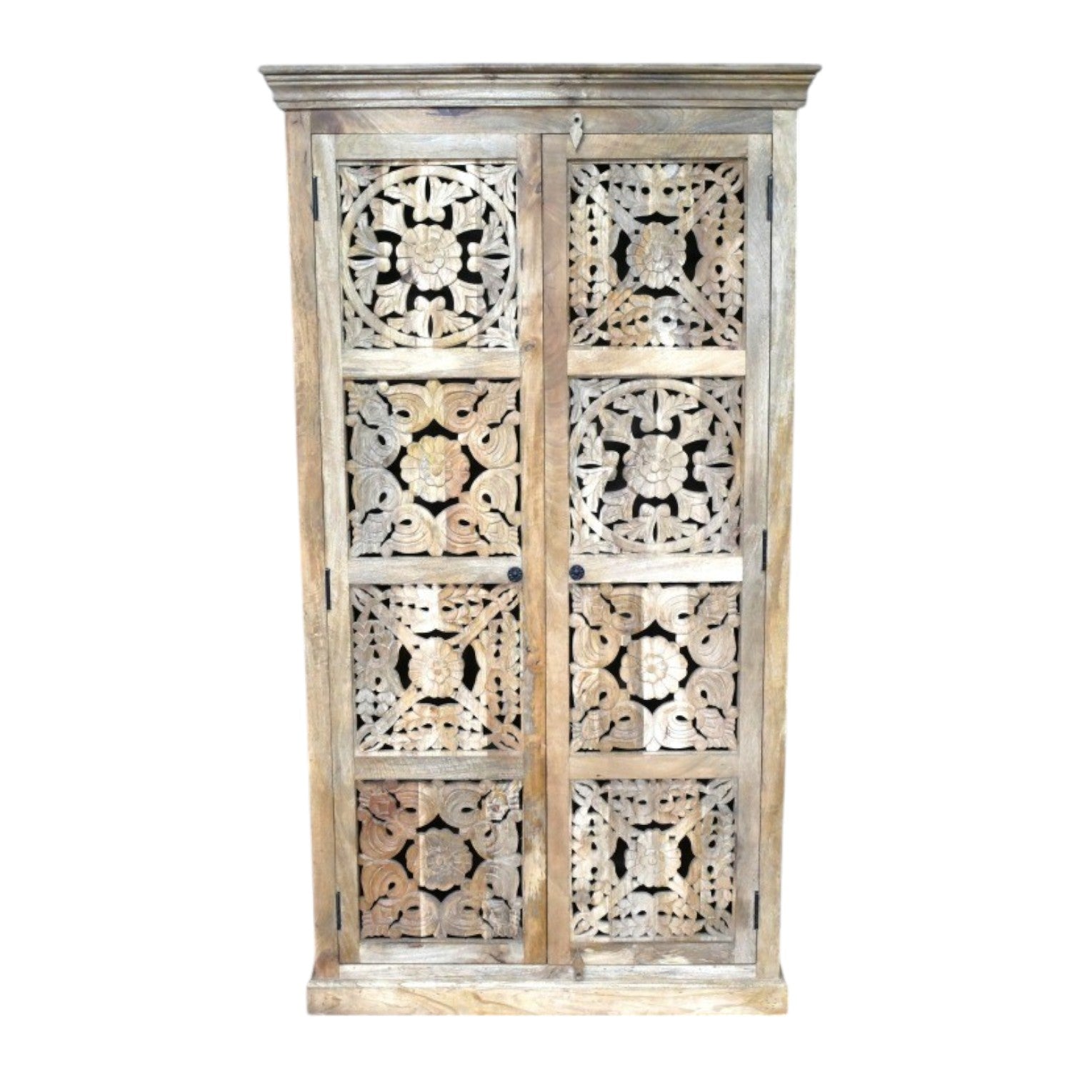 A tall, hand-carved solid mango wood cabinet measuring 180cm in height, 99cm in width, and 41cm in depth. The cabinet features two full-length doors adorned with intricate floral and geometric carvings, reflecting Eastern design influences. Finished in a natural wood tone, this piece offers ample internal storage with shelved compartments, making it both functional and decorative. 
 Suitable for various interior styles, including bohemian, rustic, and eclectic decors.