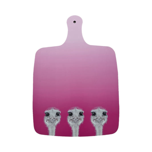 Pink cutting board with three ostrich faces on a white background