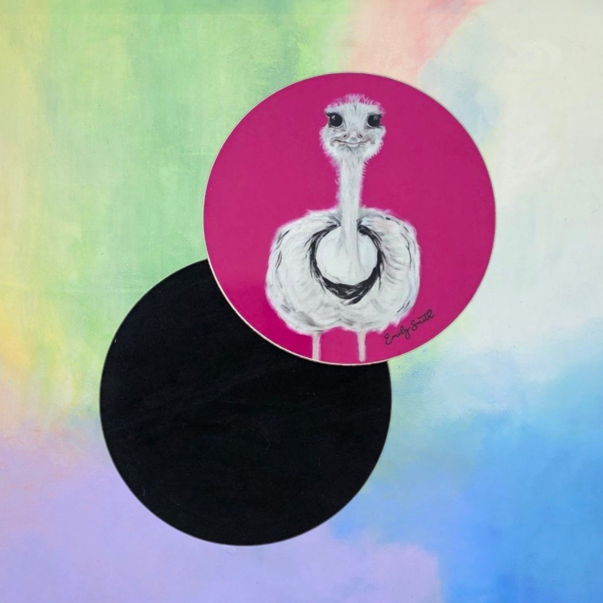 Illustration of an ostrich on a pink coaster on a colourful watercolour background