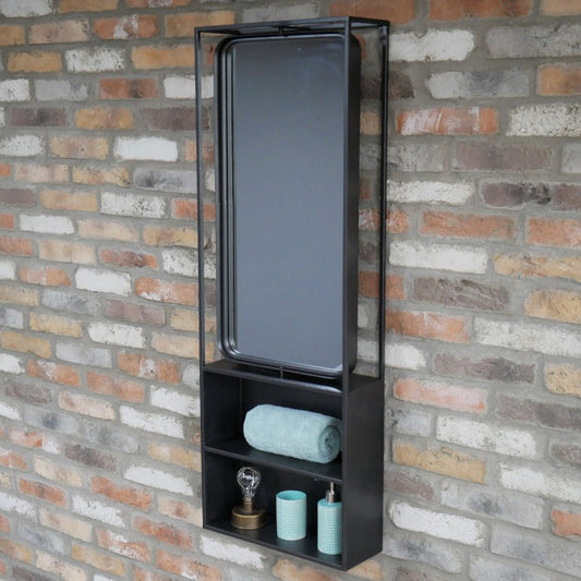 Keep your home stylishly organised with our Industrial Black Wall Mirrored Unit! This large rectangular shelf boasts a sleek black metal finish that screams industrial chic. Two spacious shelves are just begging to showcase your favourite things, and the built-in mirror at the top also adds that perfect rustic flair. With easy-to-use hooks for mounting, this playful piece will jazz up any bathroom, hallway, or kitchen!