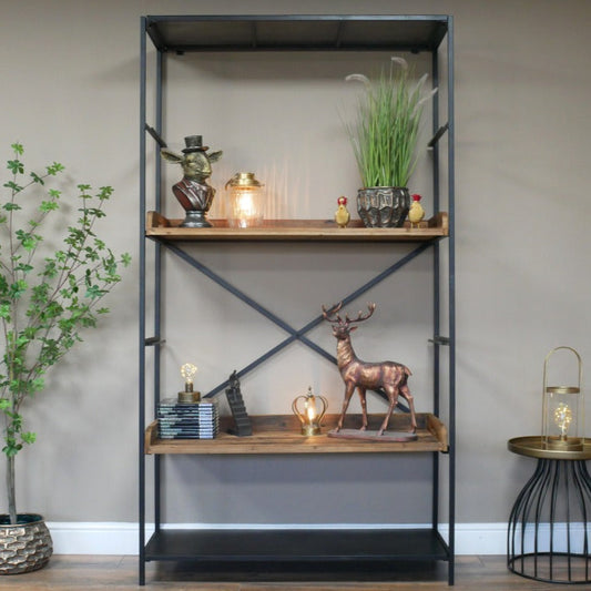 Tall industrial-style shelving unit measuring 200cm in height, 110cm in width, and 40cm in depth. Constructed with a sturdy black iron frame and five spacious reclaimed wood shelves, the unit showcases a blend of rustic and industrial aesthetics. The natural wood finish highlights the unique grain patterns, while the metal framework provides durability and a contemporary edge. This versatile piece complements various interior styles, including industrial, rustic, and modern farmhouse decor styles.
