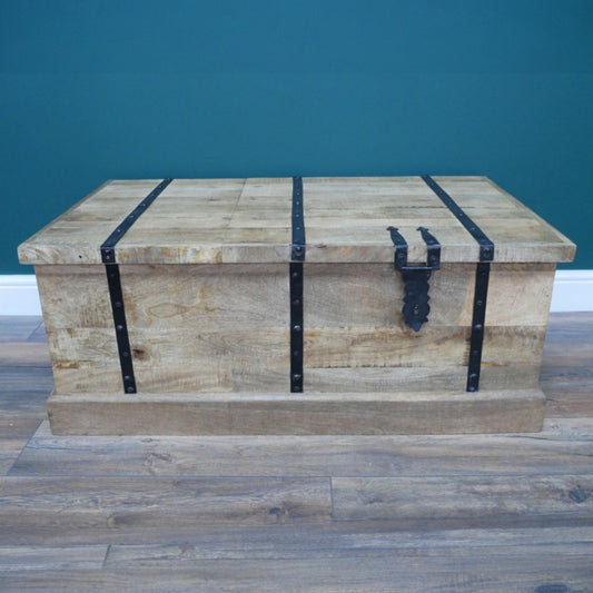 Embrace rustic style with this Rustic Wood Wine Trunk, which provides both a surface to place your favourite items on, and storage for your favourite bottles. Its rugged charm is amplified by an integrated wine rack in a crate design, perfect for showcasing your favourite bottles with flair. The spacious trunk compartment offers ample hidden storage, keeping your space effortlessly organised! Ideal for rustic, boho and coastal spaces.