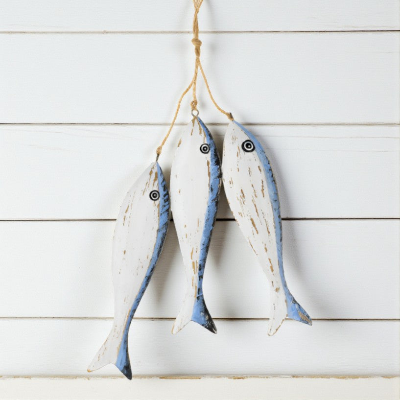 Decorative fish hanging on a wooden wall