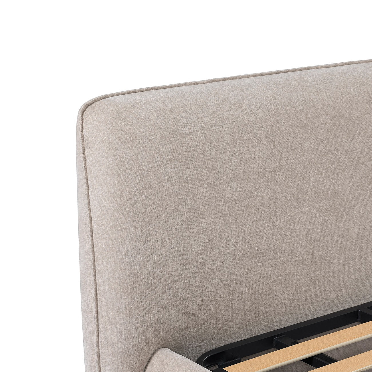 Close-up of a greige upholstered headboard with wooden slats on a white background