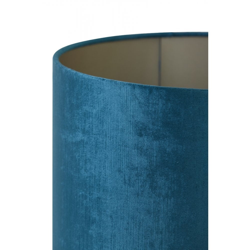 a cylindrical lampshade in turquoise blue, perfect for maximalist interiors