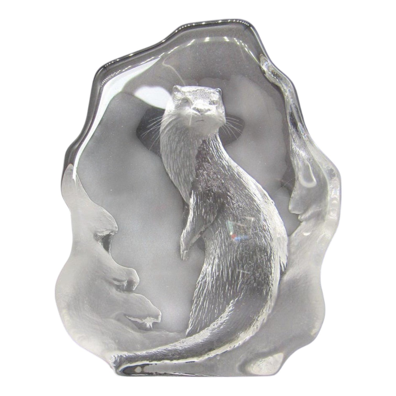 Clear crystal sculpture paperweight of an otter on a white background