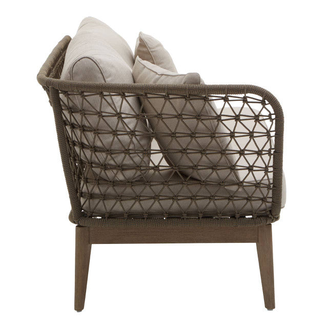 Woven chair with beige cushions on a white background