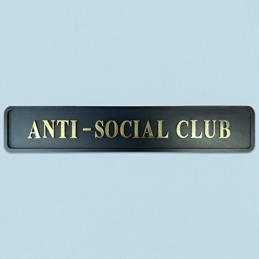 Black plaque with 'ANTI-SOCIAL CLUB' text on a light blue background