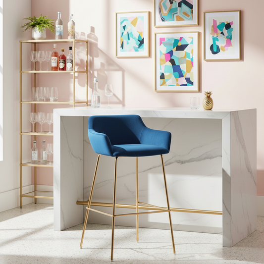 Modern home bar with a white counter, blue chair, and abstract art on a light pink wall.