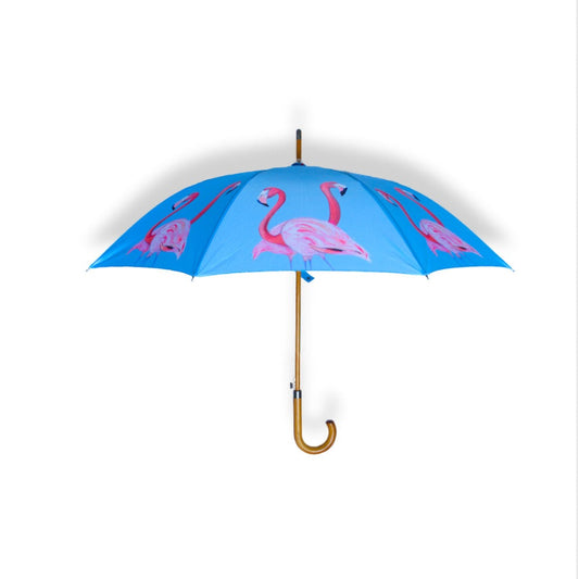 Blue umbrella with pink flamingo design on a white background
