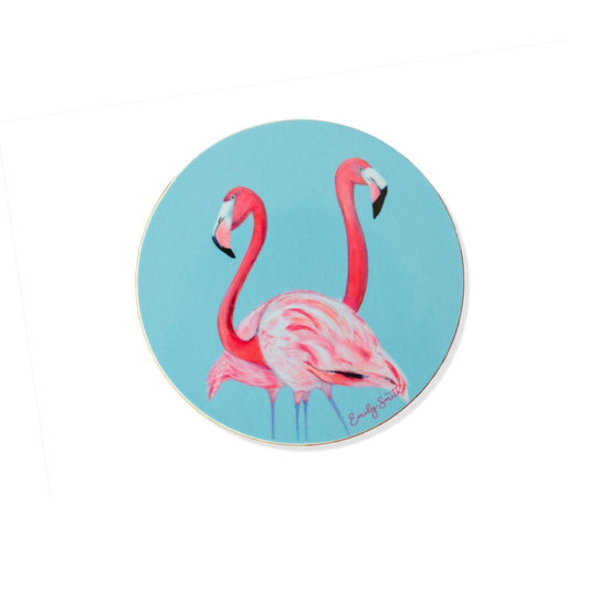 Round coaster with pink flamingo design on a blue background