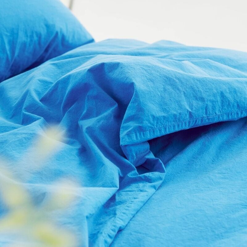 Close-up of blue bedding with a blurred background