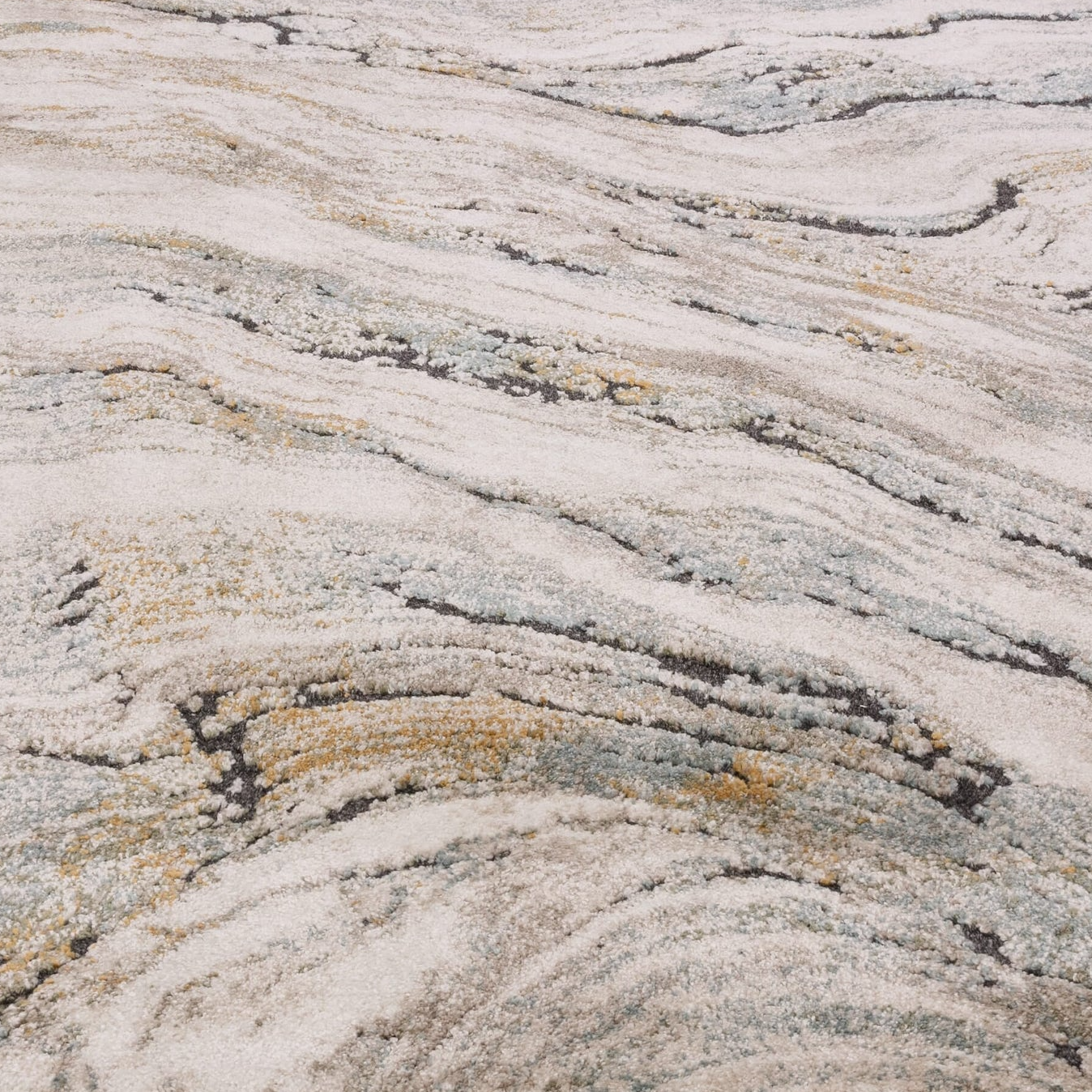 Marble-patterned surface with gray, beige, and black colors