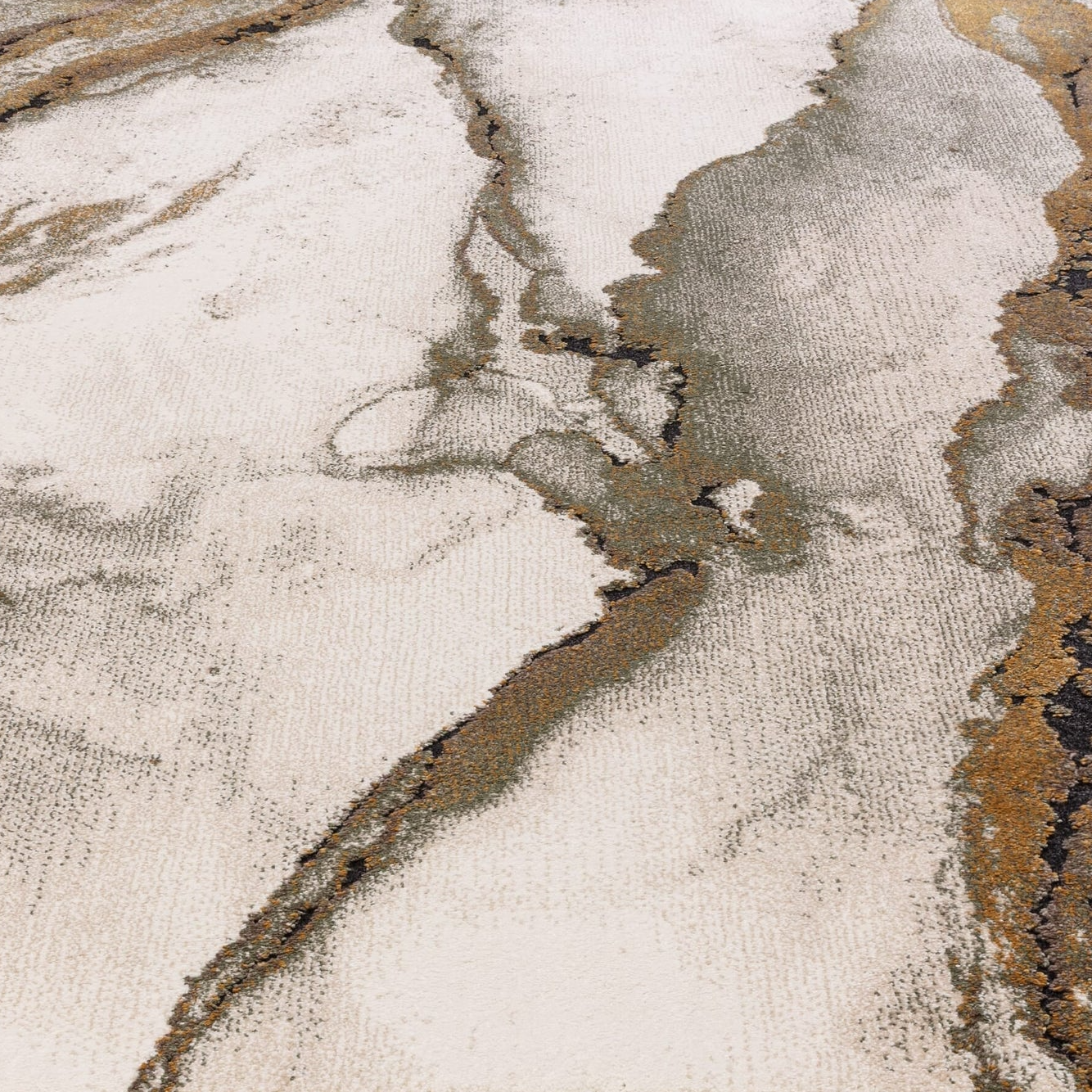 Close-up of a textured rug with neutral colors and abstract pattern