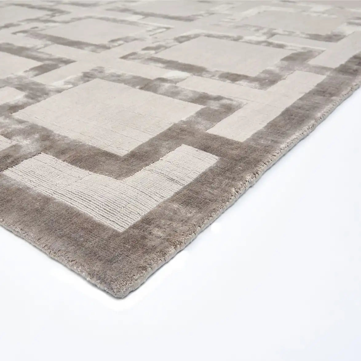 mocha geometric patterned rug on a white background