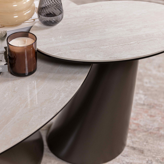 Modern coffee table with decorative items on a neutral background
