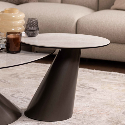 Modern living room with a beige sectional sofa and a stylish coffee table.