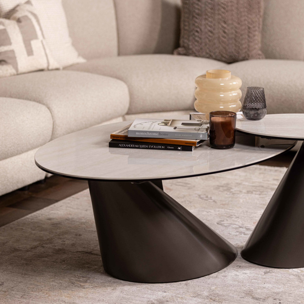 Modern living room with a beige sectional sofa and a stylish coffee table.