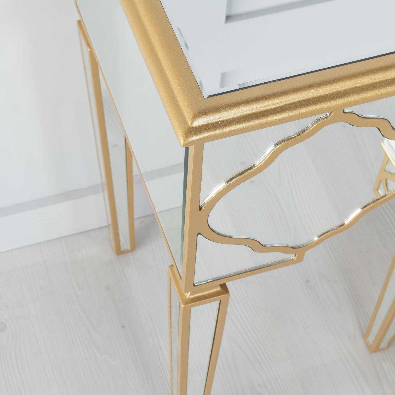 Gold-framed dresser on a white wooden floor