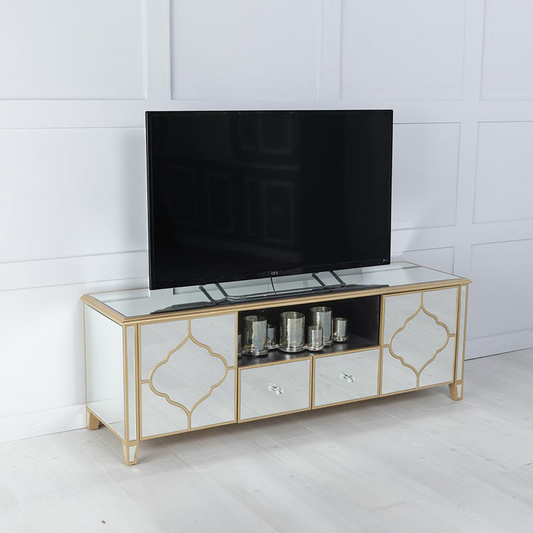 TV on a decorative stand with a white paneled wall background