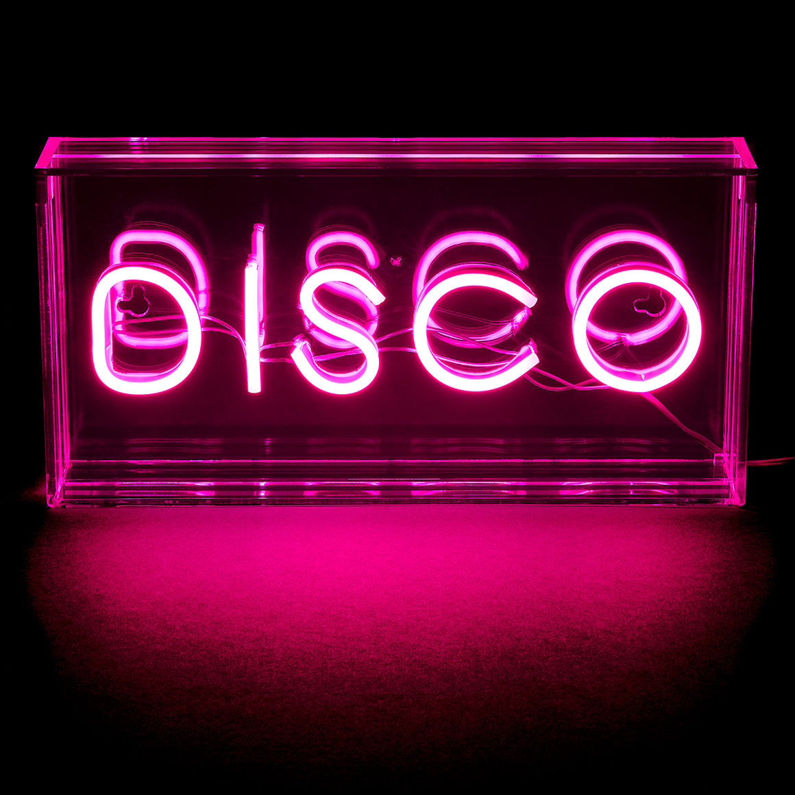 Neon sign with the word 'DISCO' in pink on a black background