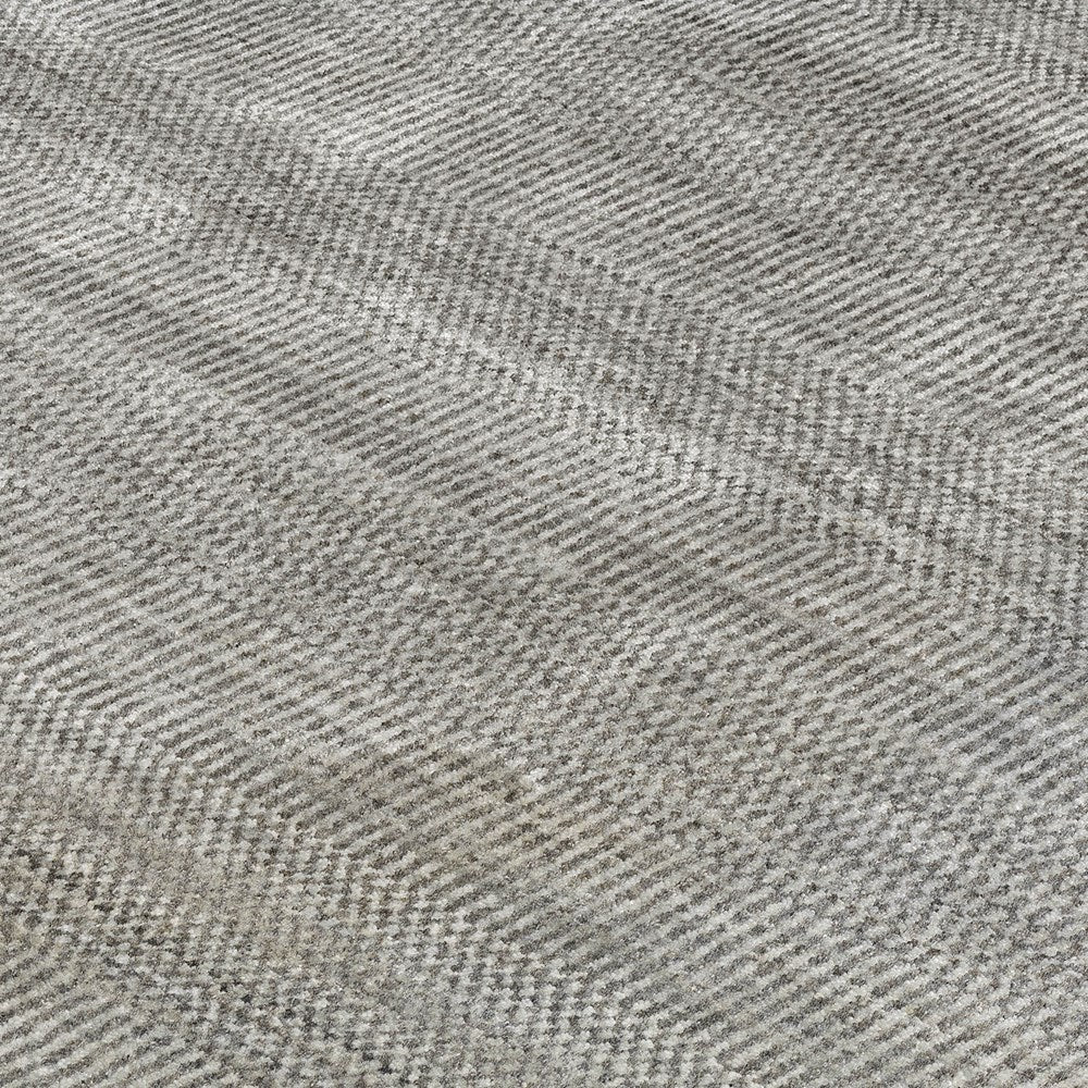 Close-up of textured gray rug with a subtle pattern