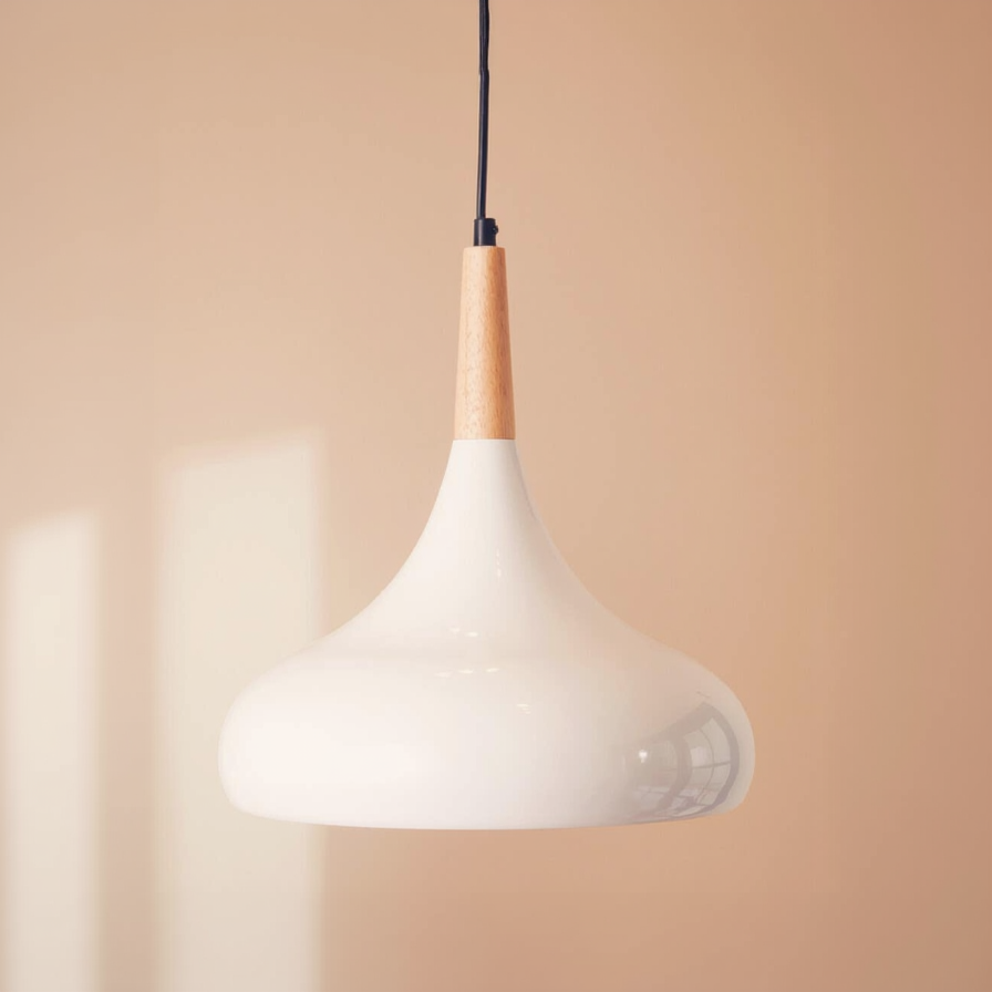 Pendant light with white shade and wooden accent on a beige background