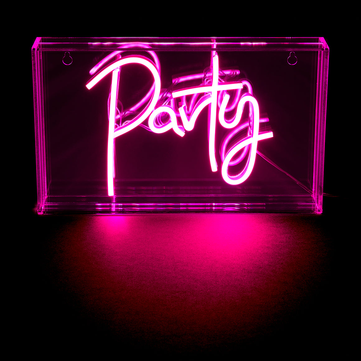 Neon sign with the word 'Party' in pink on a clear acrylic block against a black background