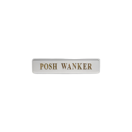 White wooden sign with golden text reading "posh wanker"