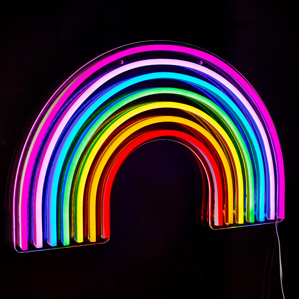 Neon rainbow arch light on a black background