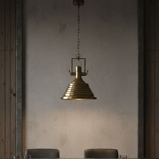 Dining area with a marble table and chairs, featuring a brass pendant light.