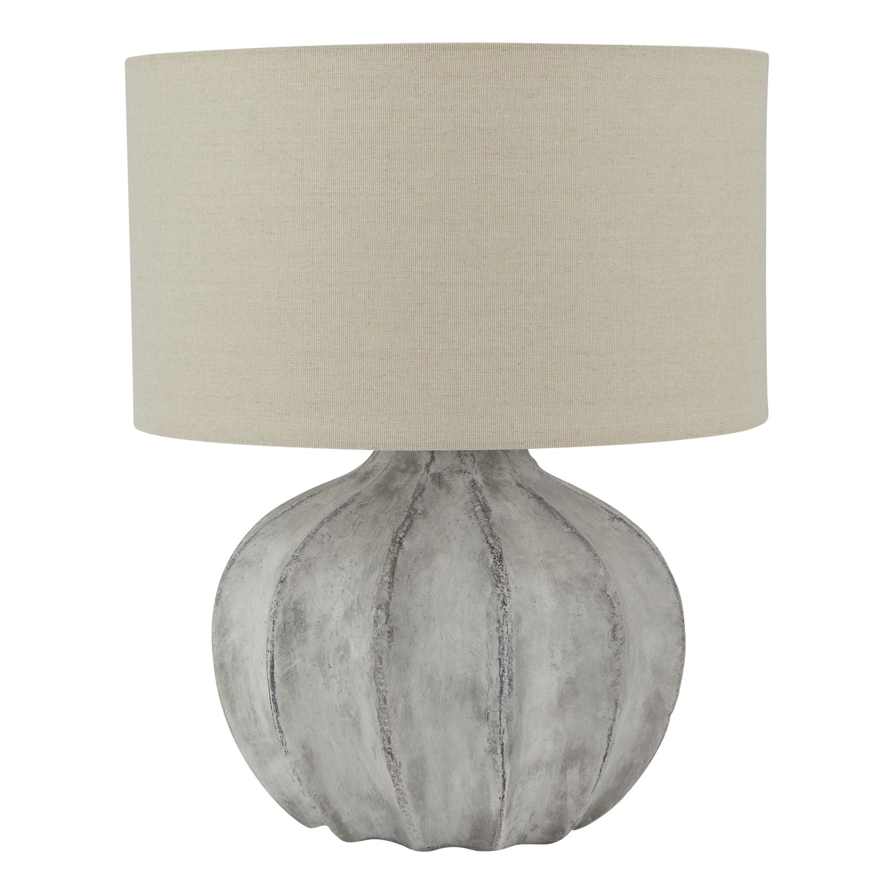 Table lamp with textured white grey base and beige lampshade on a white background