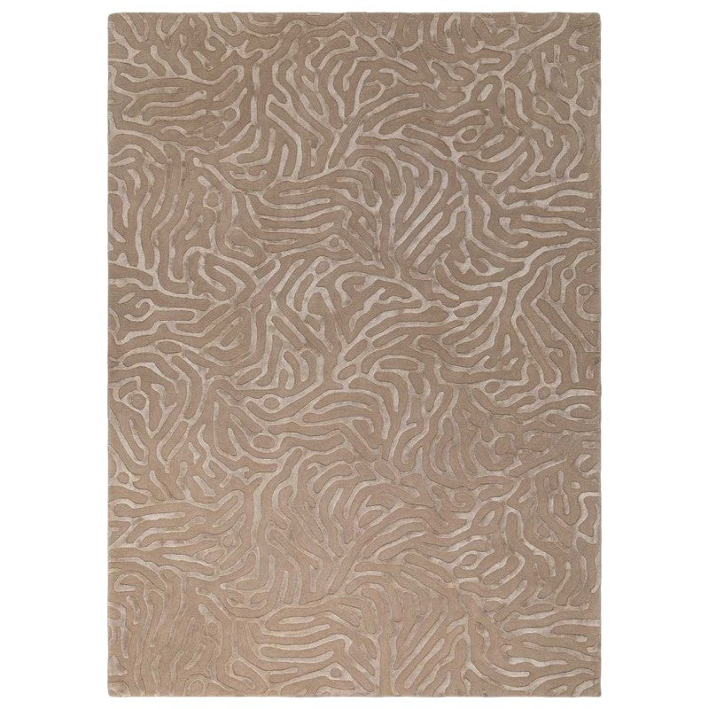 Beige area rug with wavy pattern on a white background