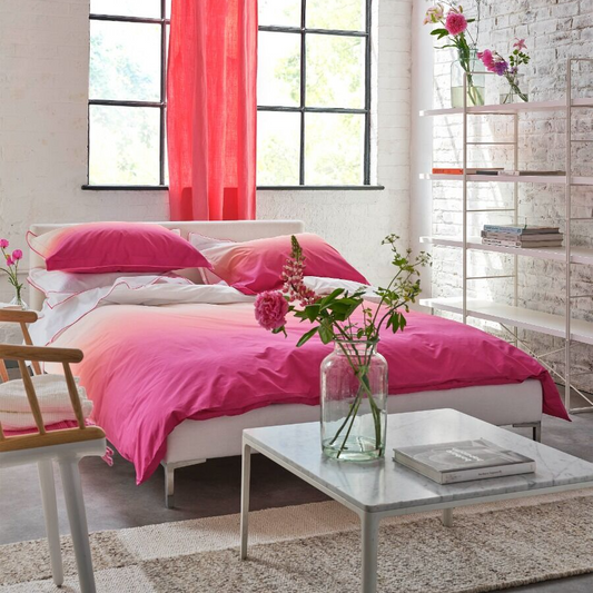 Modern bedroom with pink bedding and red curtains