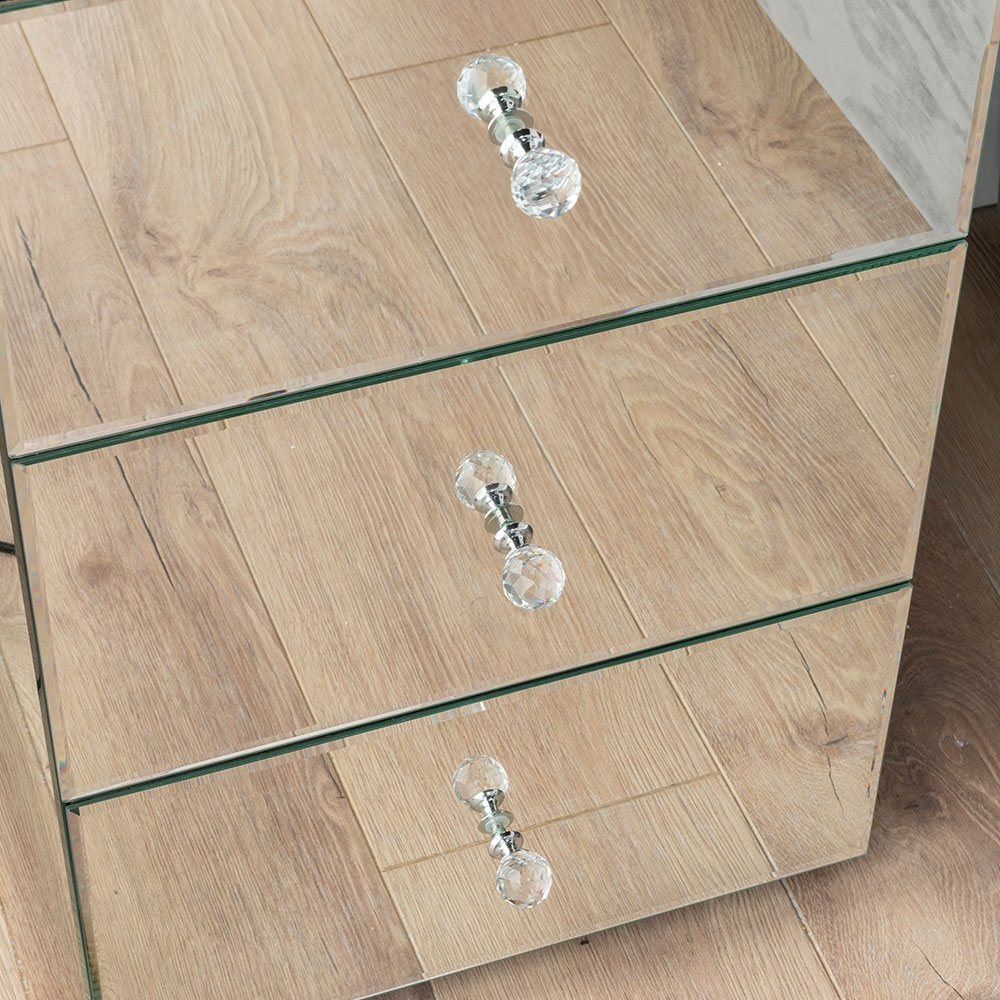 Wooden side table with glass shelves and crystal knobs on a wooden floor.
