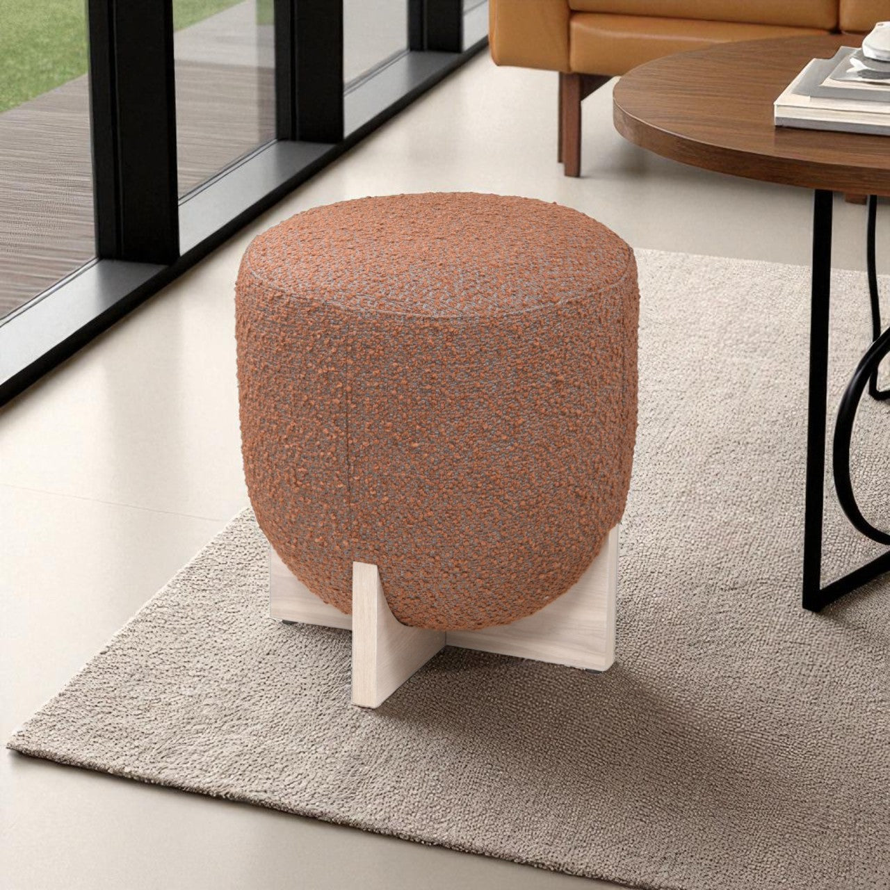 Brown textured ottoman on a rug in a living room setting