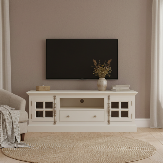 White entertainment console with a TV and decorative items in a living room.